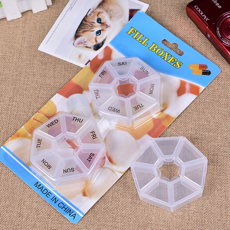 The new hot-selling seven-cell pill box mini portable storage box is divided into a circle